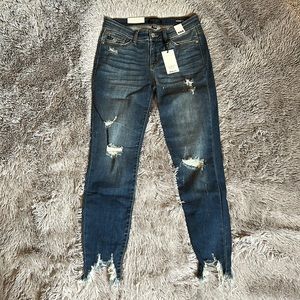 NWT Judy Blue mid rise cropped jeans with shark bite hem. Lots of stretch!